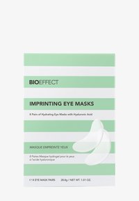Die Verpackung der Bioeffect Imprinting Eye Masks zeichnet sich durch ein mintgrünes und weiß gestreiftes Design aus. Enthält 8 Paare weißer Hydrogel-Augenmasken mit feuchtigkeitsspendenden Eigenschaften.