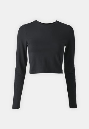 Black cropped long-sleeve shirt made from soft, stretchy fabric. Features a round neckline and fitted sleeves, with a solid color and no patterns.