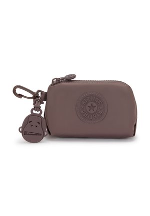 Brown silicone pouch with a zip closure, featuring a circular logo and a keychain of a monkey face. Smooth texture, compact design, and durable.