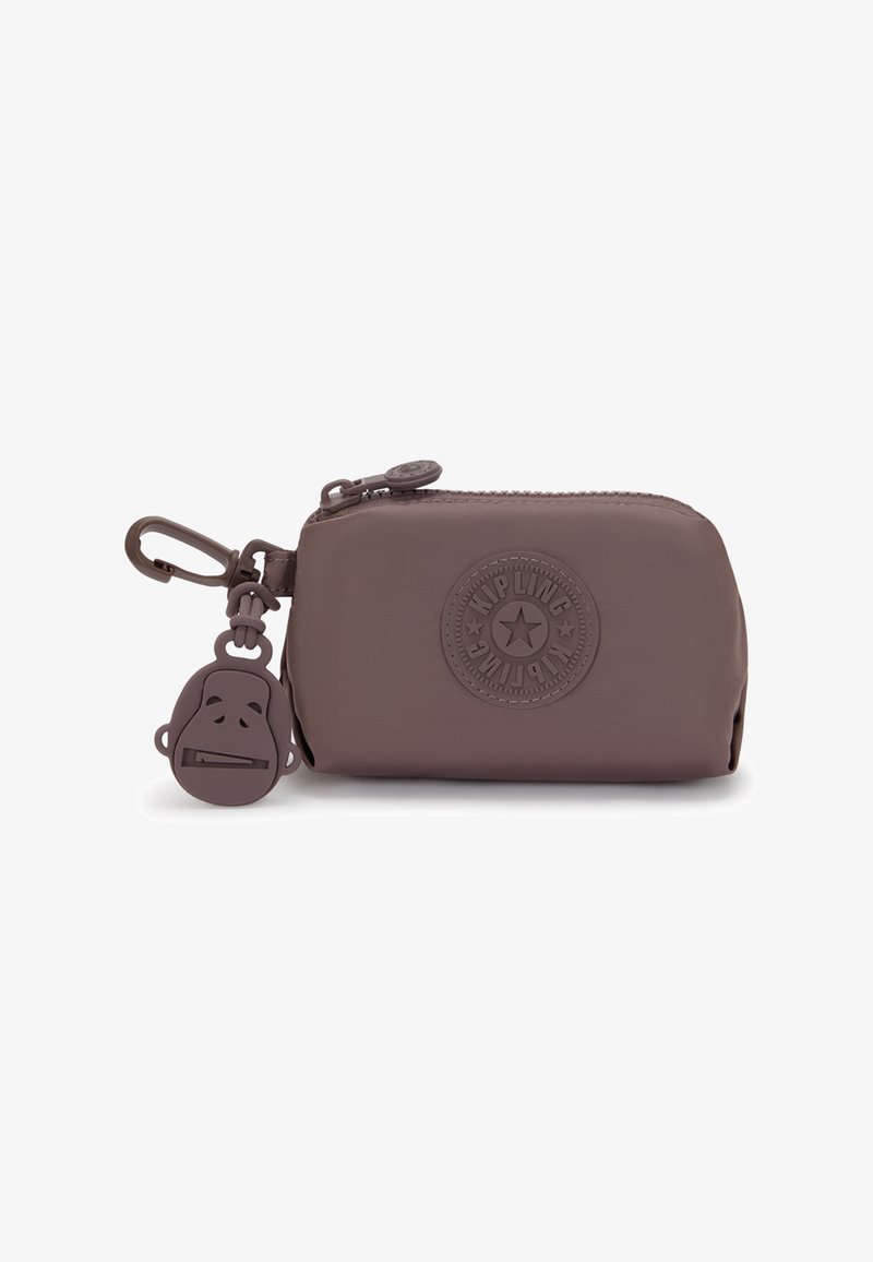 Pochette en silicone marron avec fermeture éclair, ornée d'un logo circulaire et d'un porte-clés en forme de tête de singe. Texture lisse, design compact et durable.