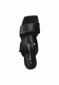 Black leather slide sandal with two wide straps. Square toe shape, smooth texture, and branded insole with "Tamaris" logo.
