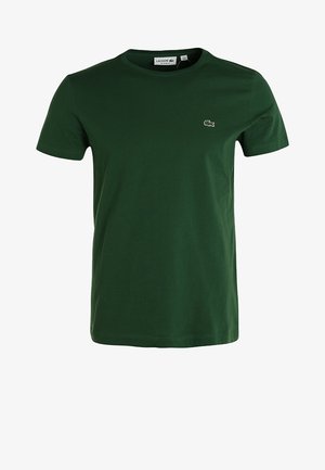 Dunkelgrünes kurzärmeliges T-Shirt mit Rundhalsausschnitt und kleinem gesticktem Lacoste-Krokodil-Logo auf der linken Brust.