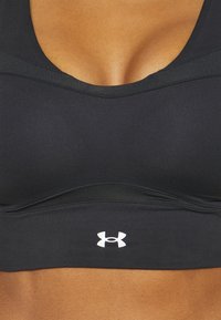 Under Armour SMARTFORM EVO MID - Sportovní podprsenky se střední oporou - black/white