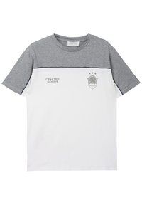 White and gray short-sleeve t-shirt featuring a textured gray upper panel, printed text, and a shield logo with palm tree design.