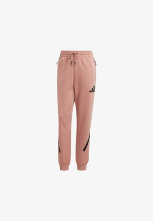Pink sweatpants with a drawstring waist, tapered ankles, and black accent stripes. Made from soft fabric, featuring a logo on one leg.