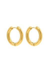 Boucles d'oreilles en or en forme d'anneau, arborant une finition lisse et polie, avec une forme circulaire et un léger détail de couture à l'endroit où les boucles se fixent.