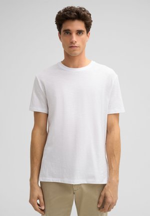 Weißes kurzärmliges T-Shirt aus leichtem Stoff. Das Kleidungsstück hat einen Rundhalsausschnitt und eine lockere Passform mit einer glatten, leicht strukturierten Oberfläche.