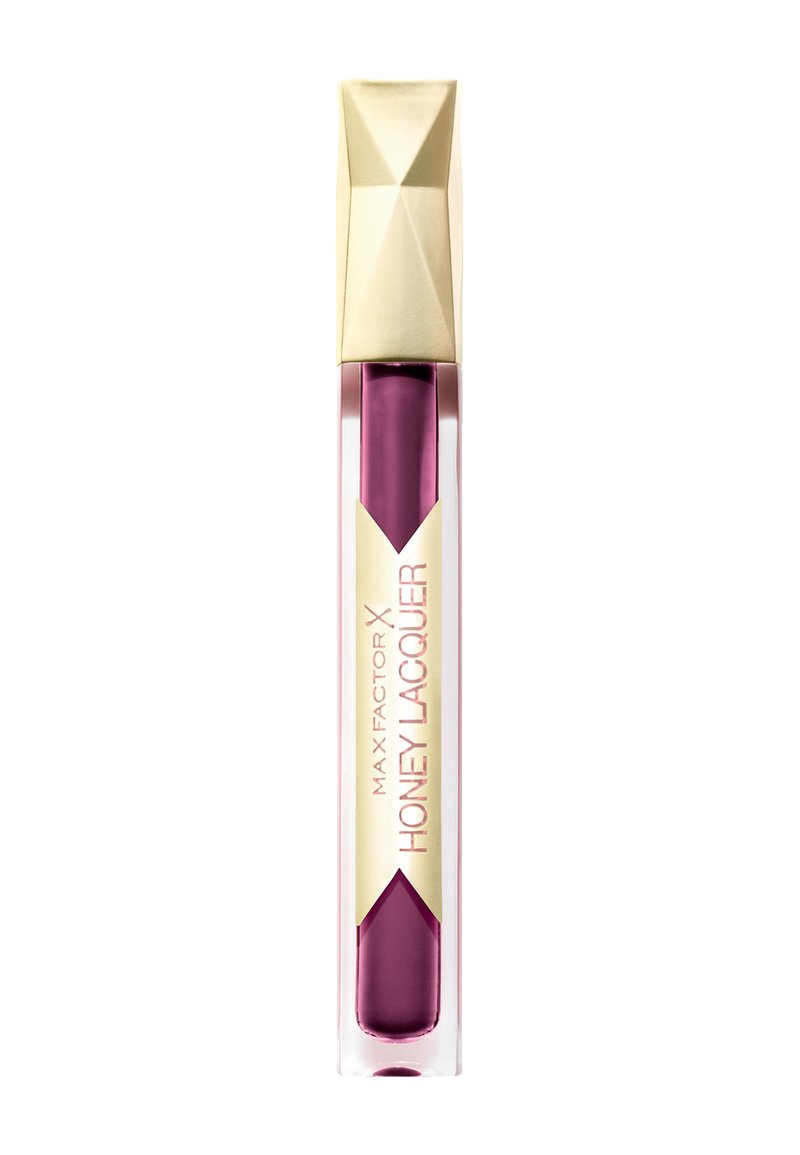 Max Factor Honey Lacquer i en transparent tube med et geometrisk guld-låg, der har en dyb blommefarve og er mærket med pink og guld.