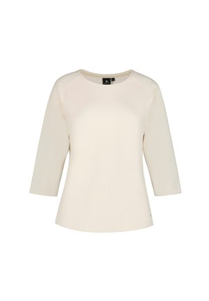 Damenshirt in Cremefarbe mit langen Ärmeln, rundem Ausschnitt und leicht ausgestelltem Saum.