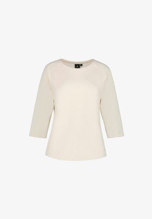 Cream-colored, long-sleeve women's top with a round neckline and slightly flared hem.