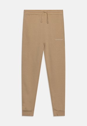 Beige, smalle joggingbukser med snøre i taljen og sidelommer, med et lille "Lyle & Scott"-logo på højre øvre lår.