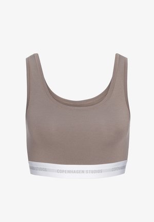 Taupe sports bra with wide straps and white elastic band at the bottom featuring "Copenhagen Studios" text.
