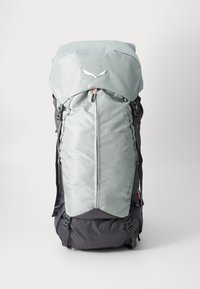 Light gray backpack with a top flap, zipper closure, and dark gray base. Features straps on the sides and a geometric texture on the fabric.
