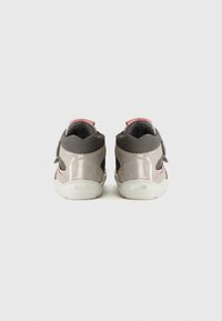 Gray synthetic high-top shoes with pink accents, featuring a textured upper, Velcro strap closure, and white rubber soles.