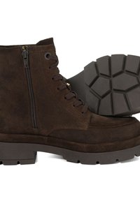 Brown suede ankle boots with brown laces, side zipper, and a rugged rubber sole featuring a geometric tread pattern.