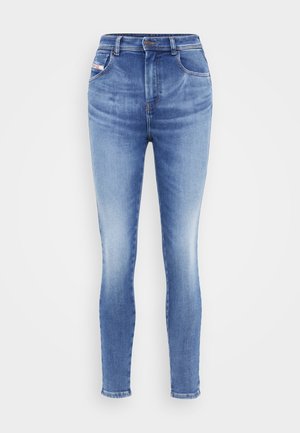 Jeans skinny cu talie înaltă, din denim albastru deschis, cu închidere cu nasture, două buzunare frontale și zone decolorate pentru un aspect purtat.