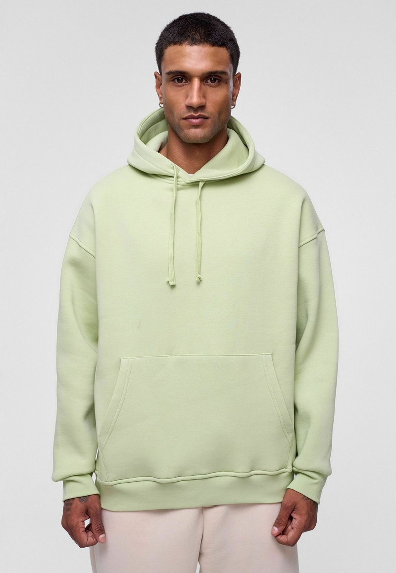 Lichtgroene hoodie van zachte stof, met een zak aan de voorkant, een trekkoordcapuchon en een ontspannen pasvorm met ribgebreide manchetten en zoom.