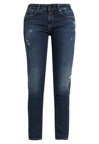 Mörkblå denimjeans med slim fit, lätt slitningar och blekningsdetaljer på låren. Standard fem-fickorsdesign med blixtlås.