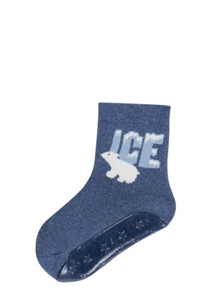 Blauer Kinderstrumpf mit einem weißen Eisbären und dem Wort "EIS" darüber, ausgestattet mit rutschfesten Stern-Griffen an der Sohle.