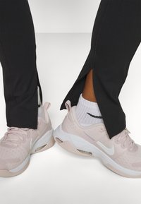 Nike Performance ONE SPLIT HEM - Leggings - black