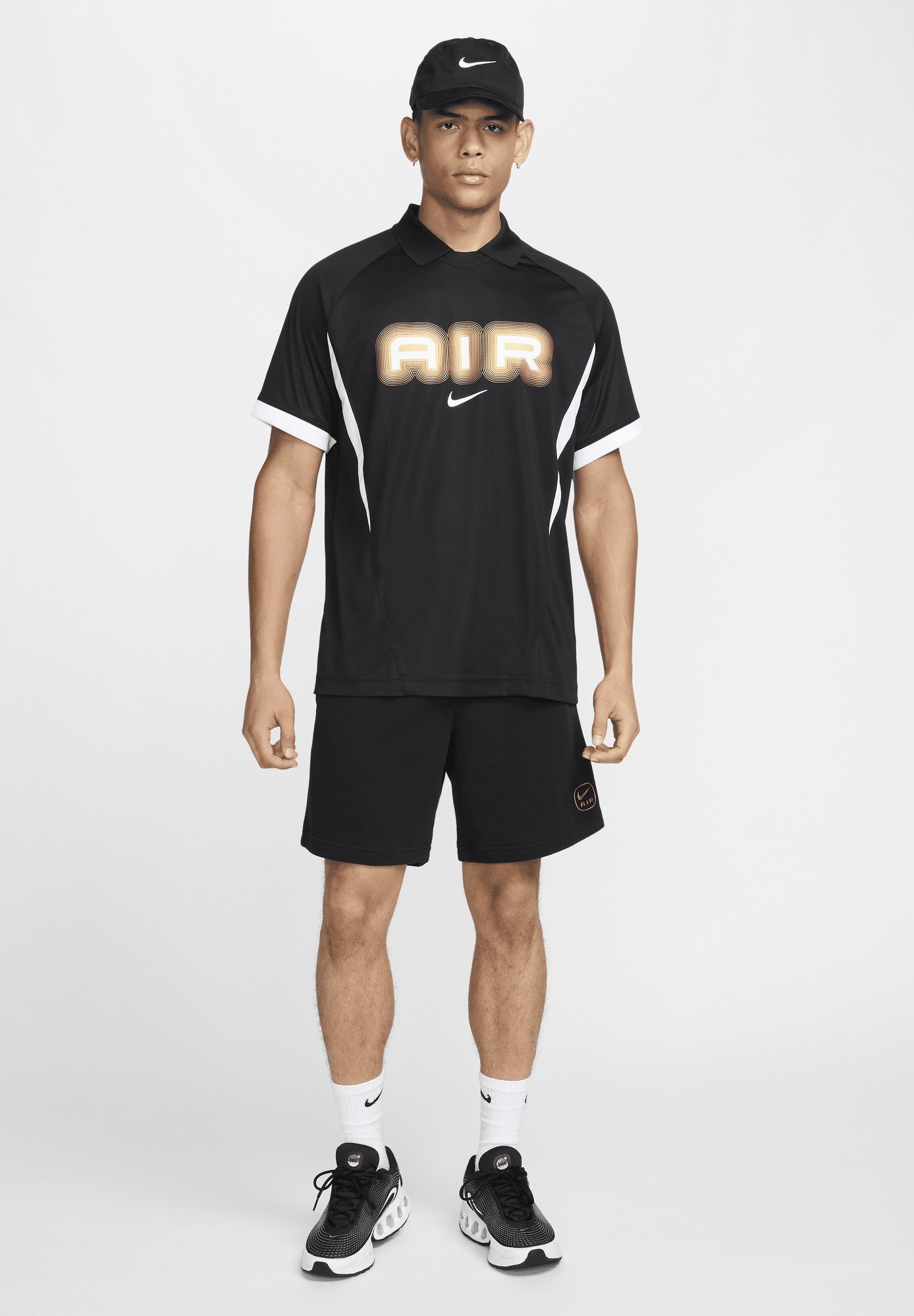 black white and gold nike shirt