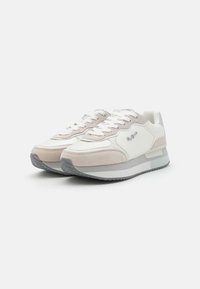 White and light gray sneakers with suede and leather materials, textured accents, round toe, and flat rubber sole. Laces in matching color.