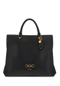 Borsa tote in pelle nera con dettagli dorati, dotata di manici doppi, una targhetta marchiata e un'etichetta decorativa per un tocco in più.