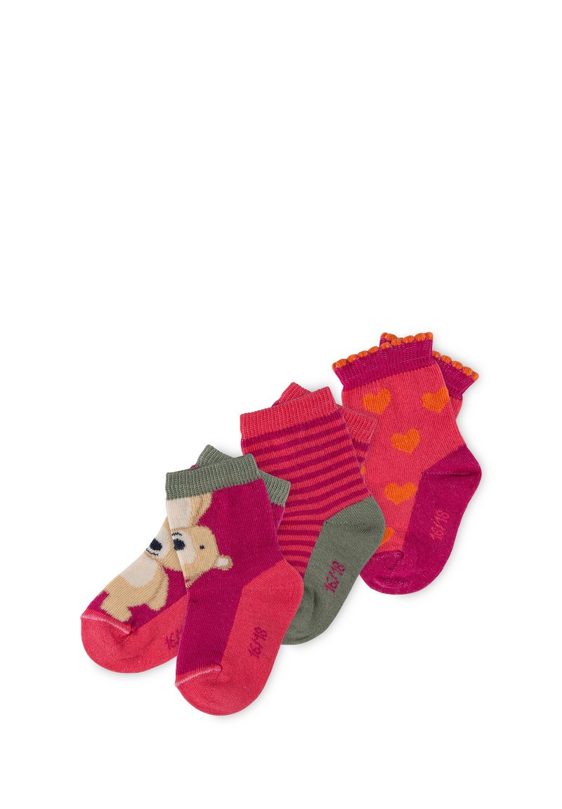 Four pairs of children's socks in varying colors: pink with bear graphic, striped pink and red, solid pink with orange hearts, and ruffled edges.