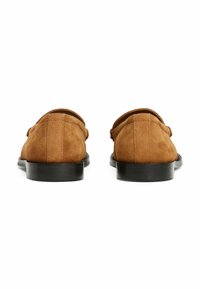 Brown suede loafers with a rounded toe, low black sole, and stitched detailing at the back, designed for a casual look.