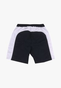 Shorts à taille élastique noirs et blancs avec des panneaux latéraux blancs et des sections avant et arrière noires, posés à plat sur un fond blanc.