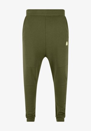 Pantalons de survêtement en coton vert avec une coupe fuselée, une taille élastique, des poches latérales et un petit logo sur le bas de la jambe.