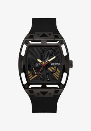 Black wristwatch with open-frame rectangular case, gold and red hands, raised black horse figure, and "GUESS" logo on the dial.