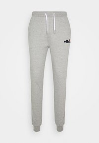 Grå sweatpants lavet af blødt stof, med snor i taljen, ribbede manchetter og et logo på venstre side.