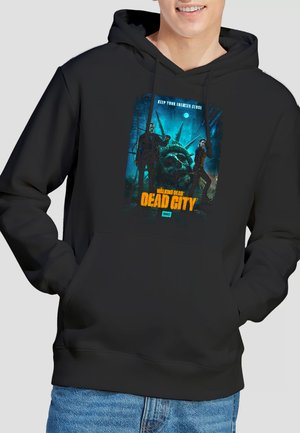 Black hoodie with "Walking Dead Dead City" graphic showing two characters with weapons and a large broken Statue of Liberty head.