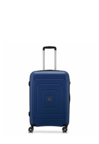 Valigia rigida di colore blu scuro, con un semplice motivo geometrico, manico estensibile argentato e quattro ruote girevoli per una facile mobilità.