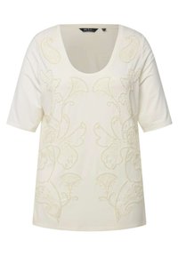 Camiseta de color crema con mangas cortas y un escote amplio, que presenta un intrincado bordado floral en hilo de contraste.