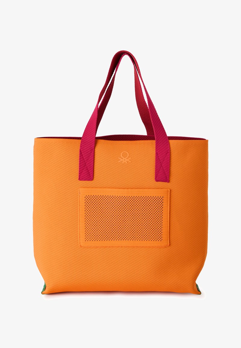 Orange textured tote bag with front mesh pocket and contrasting dark pink handles on a white background.