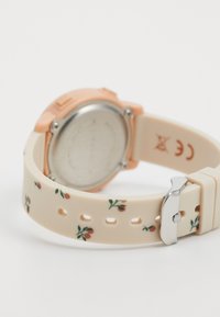 Orologio femminile con cinturino in silicone a motivo floreale nei toni crema e rosa, dotato di un fondello in acciaio inossidabile silver e finiture in oro rosa.