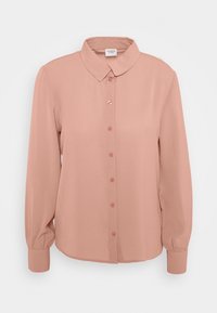 Blusa a maniche lunghe di un delicato rosa pallido, con colletto, chiusura a bottoni e maniche con polsini. Realizzata in un tessuto liscio e leggero.