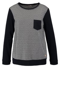 Långärmad crewneck-tröja med svarta ärmar, svart bröstficka och grå mönstrad frontpanel med geometrisk design.