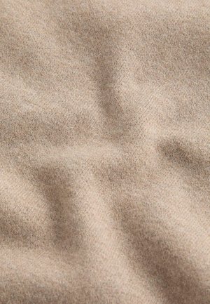 Beige fabric with a soft, slightly textured surface; features subtle variations in tone and a flexible, draped appearance.