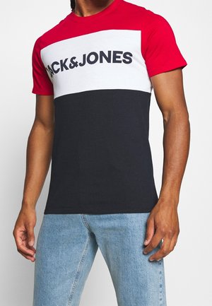 Red, white, and navy color-blocked t-shirt with "JACK & JONES" logo in black. Short sleeves and crew neckline. Soft cotton fabric.