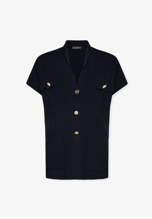 Marineblauwe mouwloze blouse met een sjaalkraag, vijf gouden knopen en twee frontzakken. Gemaakt van een gestructureerde stof.