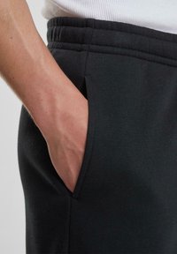 Urban Classics Tracksuit bottoms - black