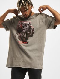 Übergroßes graues T-Shirt aus Baumwolle; verfügt über ein grafisches Profil-Design in Schwarz und Rot, das ein Gesicht mit strukturierten Details darstellt.