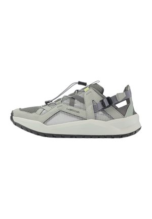 Light gray and black low-top athletic shoe with mesh panels, adjustable strap, and branded side logo, suitable for outdoor activities.