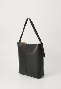Black leather shoulder bag with a smooth texture, featuring a single adjustable strap and minimalistic design. Gold-tone hardware accents.