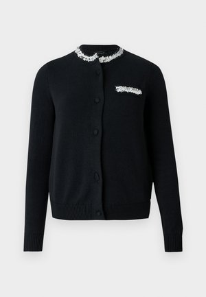 Cárdigan negro con escote redondo, cierre frontal con botones, puños y dobladillo acanalados. Presenta un cuello y un bolsillo en el pecho adornados con lentejuelas.