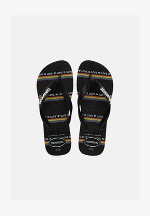 Čierne žabky s textúrovanými podrážkami, s farebnými dúhovými pásmi a opakujúcim sa textom "LOVE IS LOVE", bielym logom Havaianas na remienkoch a podrážkach.