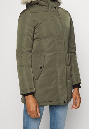 Olive green padded coat with a fur-lined hood, zip front, and side pockets. Features ribbed cuffs and a sleek, smooth texture.